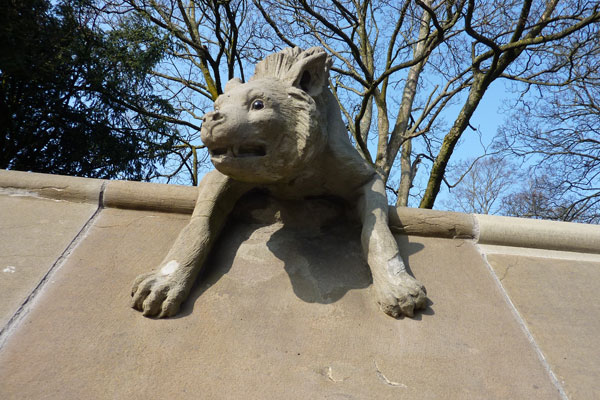 photo of stone animal on the animal wall