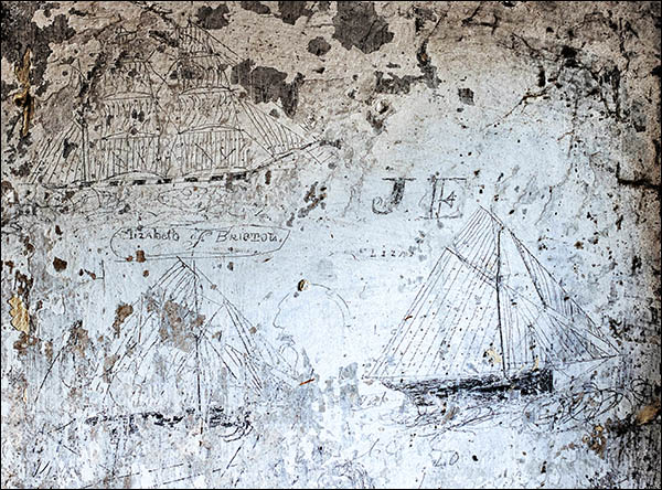 Photo of Victorian ship drawings on wall inside warehouse