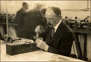 Photo of man splitting diamonds