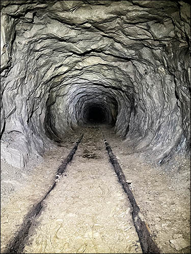 Photo of copper mine tunnel with railway track