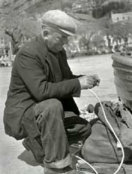 photo_of_ted_rogo_mending_nets